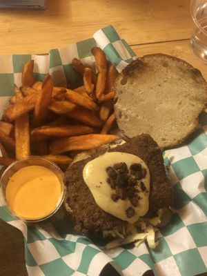 Chickn burger with slaw, pickles and “bacon"  at Just Veggiez in Madison