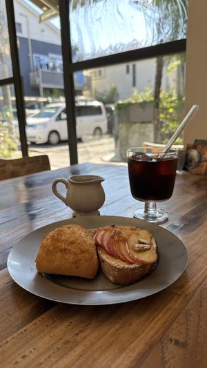 Coconut scone and apple pastry w/coffee.  at Universal Bakes and Cafe in Tokyo