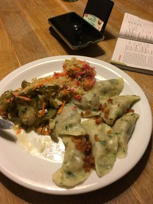 Only remembered to take after starting to eat! Vegan lentil dumplings with sauerkraut and pickle salad. at Glonojad in Krakow