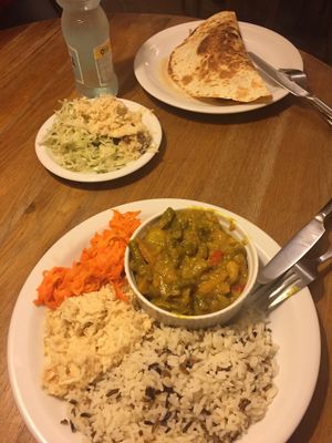 Curry and burrito with salads at Glonojad in Krakow
