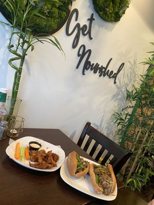 Great ambiance! Vegan bbq wings and “that Philly Jawn” sandwich   at Nourish Philly in Philadelphia