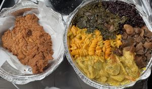 One giant piece of chick’un and a divine platter with 5 selections. (Black rice, oxtail, curry plantain, Mac n cheez, sautéed kale)  at Nourish Philly in Philadelphia