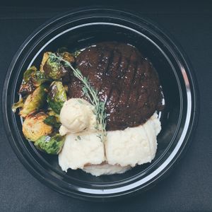 Portobello mushroom “steak” w/garlicky whipped mash taters,roasted balsamic Brussels, lemon thyme compound butter   at Veggies N'at in Pittsburgh