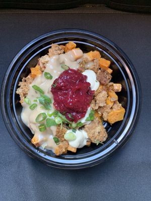 Hash 
Roasted rosemary sweet potatoes, sausage and stuffing crumble, and savory gravy topped dollops of cashew chz, cranberry jam, and scallions at Veggies N'at in Pittsburgh