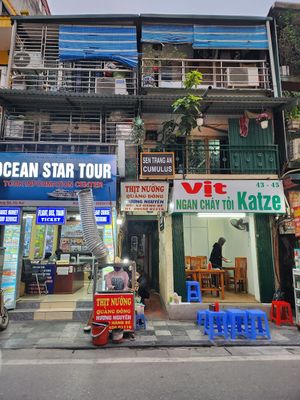 Go through the alleyway and you'll see a sign for restaurant upstairs at Katze Vegan & Vegetarian  in Hanoi