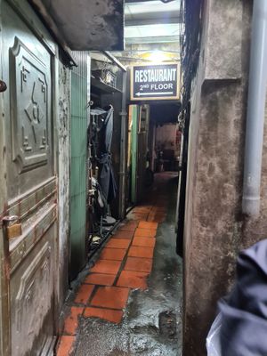 on the left side you will see this that leads you up the stairs to the restaurant at Katze Vegan & Vegetarian  in Hanoi