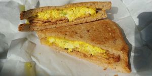 $6.99 Fak'n Bac'n and Tofu egg sandwich. Really good! at Common Market Food Co-op in Frederick