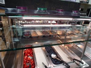 Vegan parfait options: far right is coconut yogurt, blueberries, dairy yogurt, strawberries at Common Market Food Co-op in Frederick