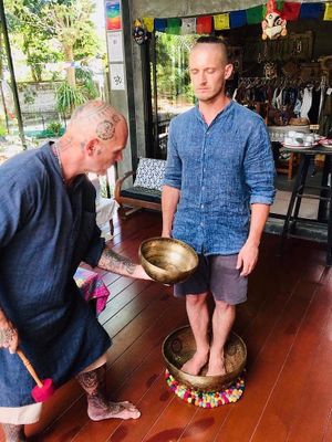Demonstrating sound bowls at Jungala in Phuket