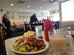 Vegan scramble with beautiful art in the background at Nancy's Café in Auburn