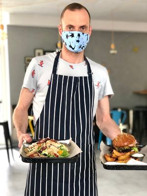Caesar salad and burger at IBA.TU Bistro in Vysoke Tatry