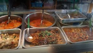 Trays & pots of food at Vegetarian Food by Somjan in Lampang