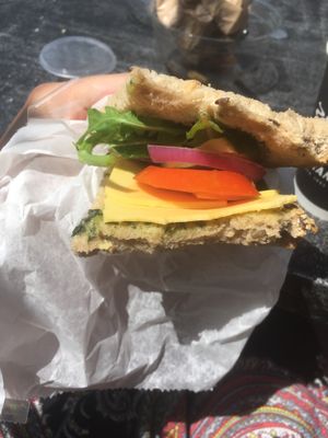 Vegan sandwich — fresh vegetables, rocket, pesto, whole wheat bread and vegan yellow cheese  at Cafe Katan ba Rashi  in Ramat Gan