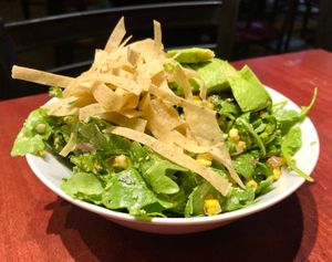 Arugula Corn Salad (Vegetarian)
arugula, grilled corn, avocado, red onion, scallions, jalapeño, lime, queso fresco, crispy tortilla strips, cilantro green goddess dressing at Molly Malloy's in Philadelphia