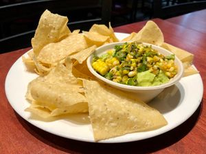 Grilled Corn Guac (Vegan)
grilled corn, avocado, red onion, jalapeño, scallions, cilantro, lime, tortilla chips at Molly Malloy's in Philadelphia
