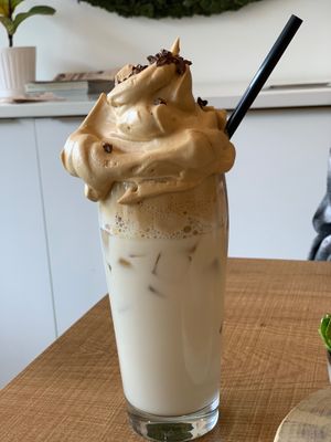Ice queen. Oat milk and whipped coffee. I know, I was wondering if you eat it or drink it as well.  at Grounds & Greens Cafe in White Rock