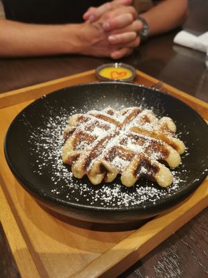 Waffles with a delicious passionfruit sauce at Chi in Vancouver
