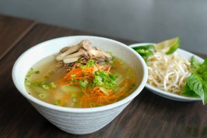 Pho Ga - Hand shredded chick’n king oyster mushroom, tofu, basil, kaffir lime leaf, bean sprout, rice noodles, fragrant broth at Chi in Vancouver