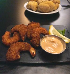 Vegan shrimp (konjac) and garlic knots bread rolls. at Neon Tiger in Charleston