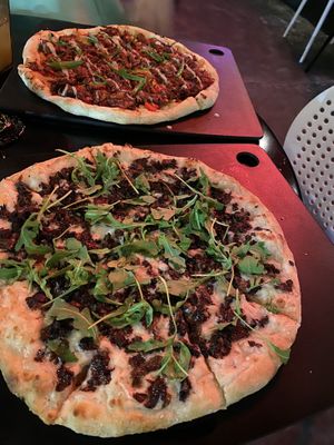 Mushroom pizza and BBQ jackfruit pizza  at Neon Tiger in Charleston