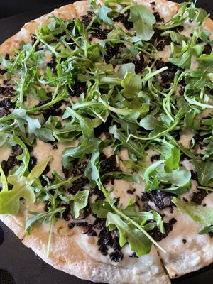 Magical pizza with mushrooms and arugula 🙌 at Neon Tiger in Charleston
