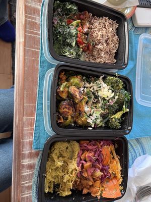 Top to bottom: kale Caesar with coconut rice and added peppers; Brussels sprouts, cider slaw, & broccoli Caesar; spaghetti squash, sweet potato hash, & Thai carrots  at Vessel Kitchen in Salt Lake City