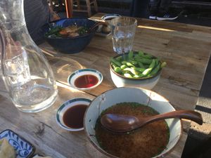Soupe miso et bol d’edamame  at Neko Ramen in Paris