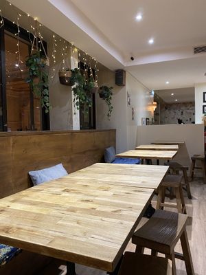 Seating area on top floor  at Neko Ramen in Paris