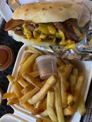 Vegan truffle mushroom & cheese burger With chip shop curry fries and vegan burger sauce. Delicious! at The Dead Pigeon in Rochester