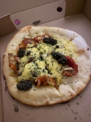 Fully loaded vegan garlic bread with sun-dried tomatoes vegan cheese and tapenade at The Dead Pigeon in Rochester