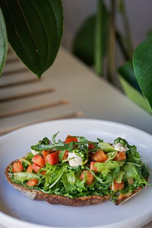 Wild garlic sourdough toast with cream cheese at Commune Cafe in Tallinn