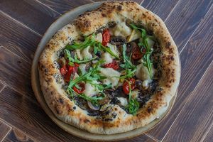 Tartufo - truffel and artisan vegan mozzarella pizza  at Commune Cafe in Tallinn
