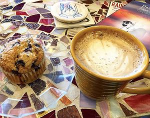 Oat milk latte and vegan blueberry muffin  at Drifting Grounds in Ocean View