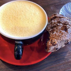Non dairy turmeric orange latte and vegan scone  at Drifting Grounds in Ocean View