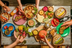 A full of vegan food in a table for 5 people  at iVegan Supershop Westlake Hanoi - Healthy Plant Based Cafe in Hanoi