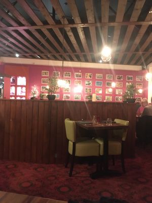 Spacious dining room with beautiful photos on the wall at Coppers in Hythe
