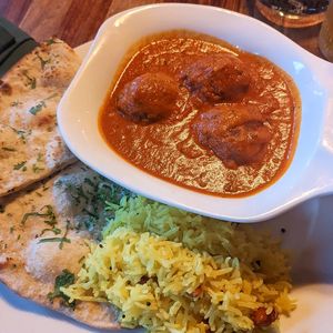Badami lauki kofta (bottle gourd dumplings) with lemon rice and naan at Coppers in Hythe