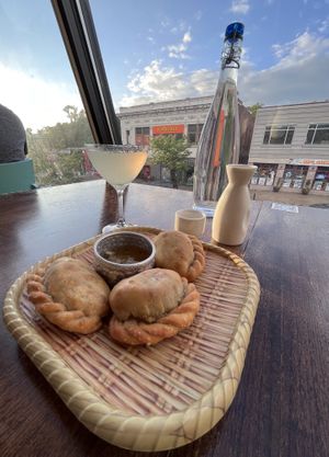 curry puffs, plus margarita and peach sake  at Kiin Lao & Thai Eatery in Pittsburgh