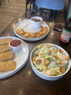 Mozzarella sticks (left), bruschetta (center), and Caesar salad (right)  at Pizza Verde in Fort Worth