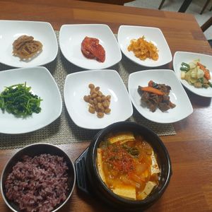 Tofu jiggae and banchan. at Soban Vegan 소반 비건식당 in Busan