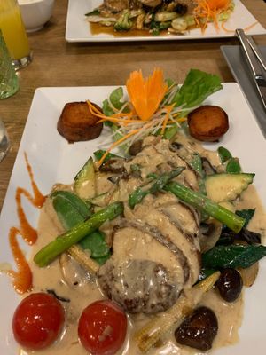 The faux chicken with rosemary soy cream and amazing variety of vegetables at Vevi in Vienna