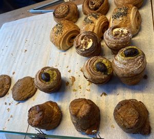 Offering of Saturday 19 April 2025: at the bottom you see kouign amann (a pastry from Bretagne). It’s crispier and sweeter than a croissant. I like it!  at Loaf Sourdough Bakery in Utrecht