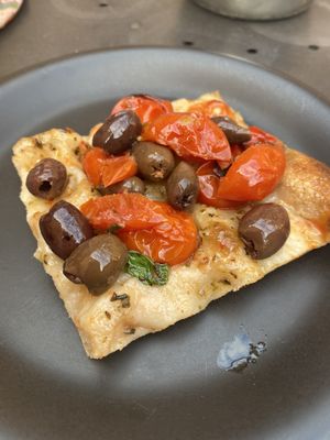 Olive and tomato pizza at Prima la Materia in Rome