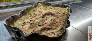 zucchini gratin, red onions, pine nuts, and salted ricotta, at Amendūla Café in Paris