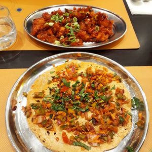 Gobi manchurian and masala papad. Both vegan, both awesome. at Krishna Vilas in Eindhoven