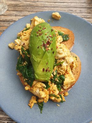 Tofu Scramble on Sourdough with chilli flakes and avocado at Claire's Wholesome Kitchen in Springfield Central