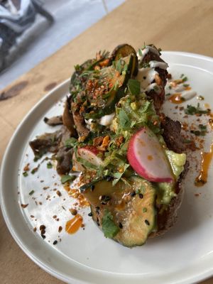 Avocado toast with grilled mushrooms  at NEØ Coffee House in Barcelona