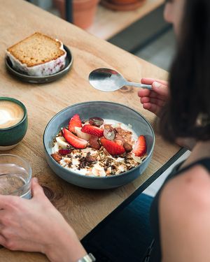 Granola bowl with soy yogur, fruit purée and fresh fruits at NEØ Coffee House in Barcelona