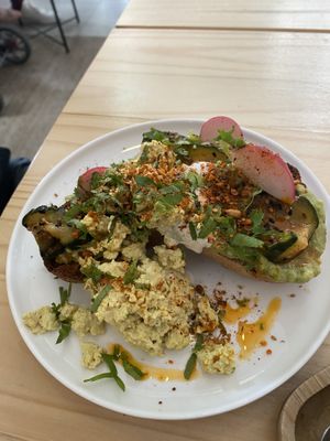 Tostada avocado and scrambled tofu  at NEØ Coffee House in Barcelona