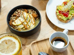 Granola with apple puree, peanut butter and coco. Avo-toast. Espresso (Season Blend, by Animal Coffee). Iced rooibos with lemon. at NEØ Coffee House in Barcelona